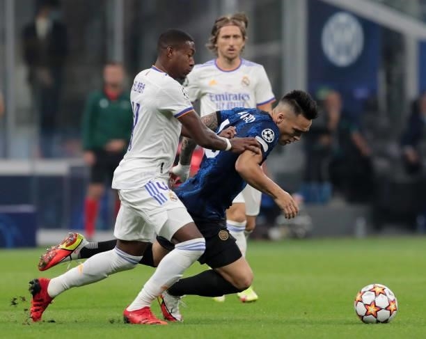 Lautaro Martínez of FC Internazionale battles for possession with David Alaba of Real Madrid in action during the UEFA Champions League group D match...
