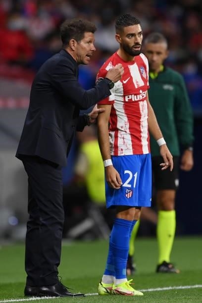 Diego Simeone, Head Coach of Atletico Madrid interacts with Yannick Ferreira Carrasco of Atletico Madrid during the UEFA Champions League group B...