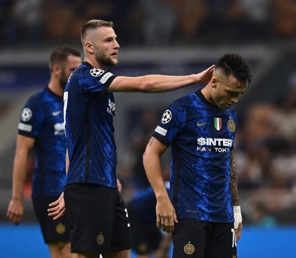 Milan Skriniar and Lautaro Martinez of FC Internazionale react during the UEFA Champions League group D match between Inter and Real Madrid at...