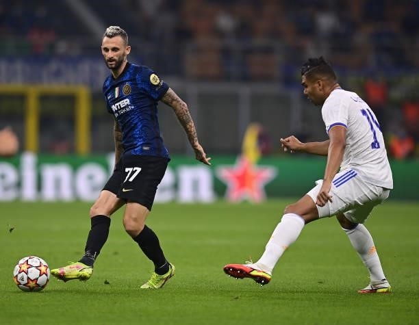 Marcelo Brozovic of FC Internazionale competes for the ball with Casemiro of Real Madrid the UEFA Champions League group D match between Inter and...