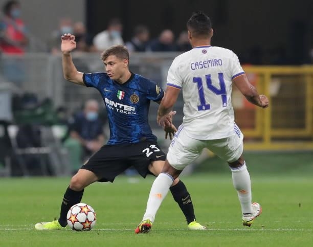Nicolo Barella of FC Internazionale is challenged by Casemiro of Real Madrid during the UEFA Champions League group D match between Inter and Real...