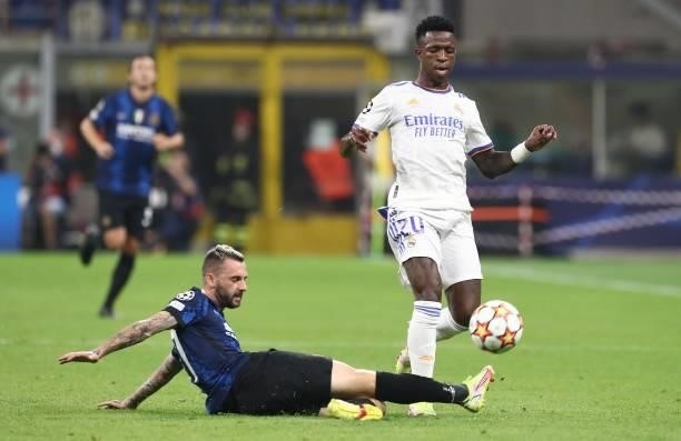 Vinicius Junior of Real Madrid competes for the ball with Marcelo Brozovic of FC Internazionale during the UEFA Champions League group D match...