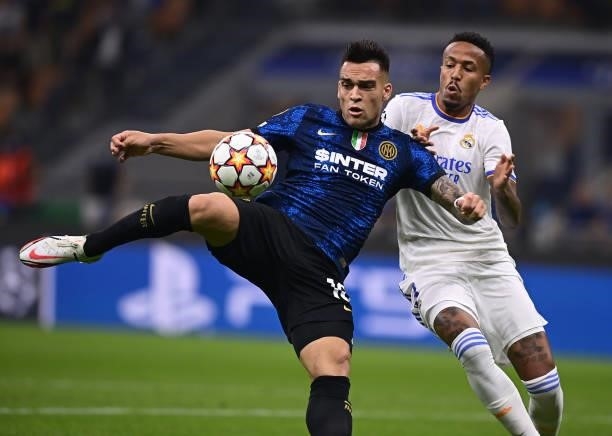Lautaro Martinez of FC Internazionale competes for the ball with Eder Militao of Real Madrid during the UEFA Champions League group D match between...