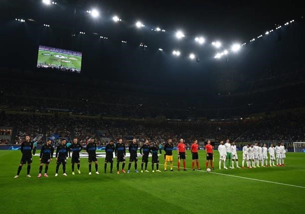 Players of FC Internazionale and players of Real Madrid line up prior to the UEFA Champions League group D match between Inter and Real Madrid at...