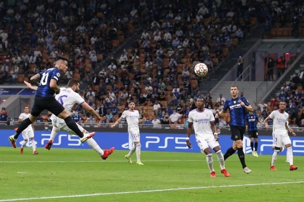 Lautaro Martinez of FC Internazionale heads towards goal only for his effort to be saved by Thibaut Courtois of Real Madrid during the UEFA Champions...