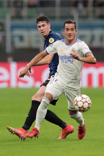 Alessandro Bastoni of FC Internazionale is challenged by Lucas Vázquez of Real Madrid during the UEFA Champions League group D match between Inter...