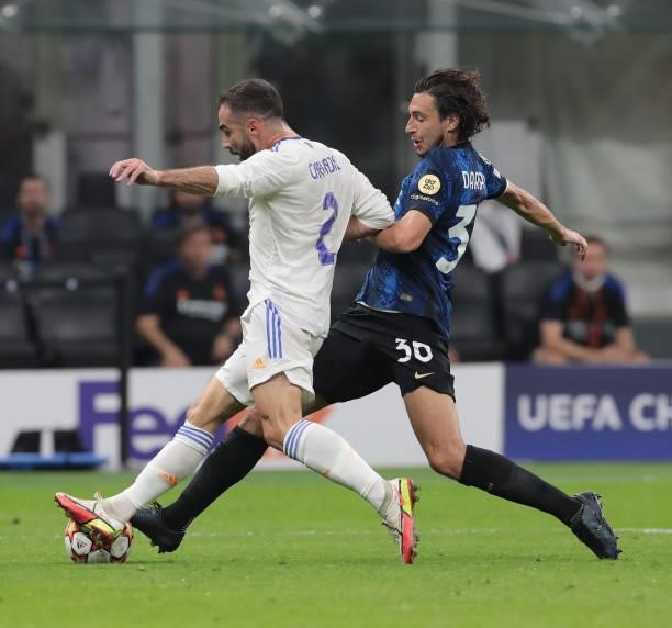 Matteo Darmian of FC Internazionale is challenged by Daniel Carvajal of Real Madrid during the UEFA Champions League group D match between Inter and...