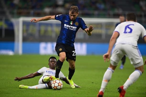 Nicolo Barella of FC Internazionale competes for the ball with Vinicius Junior of Real Madrid during the UEFA Champions League group D match between...