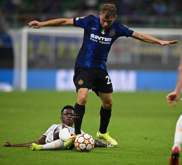 Nicolo Barella of FC Internazionale competes for the ball with Vinicius Junior of Real Madrid during the UEFA Champions League group D match between...