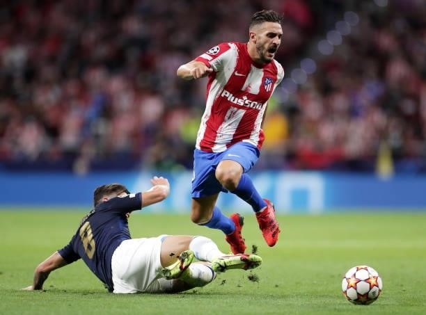 Koke of Atletico Madrid is tackled by Mateus Uribe of FC Porto during the UEFA Champions League group B match between Atletico Madrid and FC Porto at...