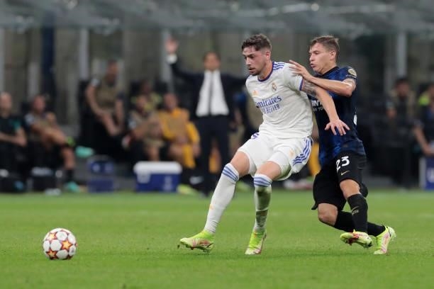 Nicolo Barella of FC Internazionale battles for possession with Federico Valverde of Real Madrid during the UEFA Champions League group D match...