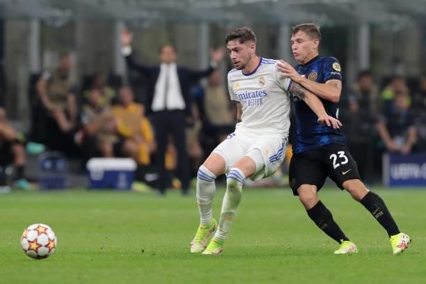 Nicolo Barella of FC Internazionale battles for possession with Federico Valverde of Real Madrid during the UEFA Champions League group D match...