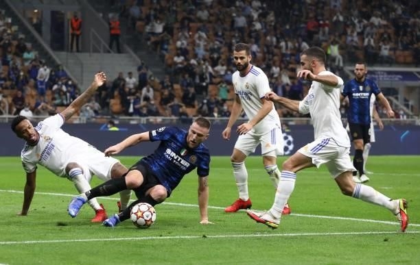 Milan Skriniar of FC Internazionale competes for the ball with David Alaba of Real Madrid during the UEFA Champions League group D match between...