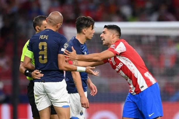 Luis Suarez of Atletico Madrid interacts with Pepe of FC Porto during the UEFA Champions League group B match between Atletico Madrid and FC Porto at...