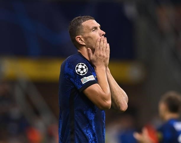 Edin Dzeko of FC Internazionale reacts during the UEFA Champions League group D match between Inter and Real Madrid at Giuseppe Meazza Stadium on...