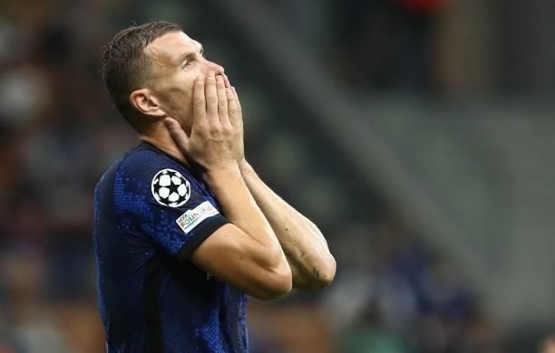 Edin Dzeko of FC Internazionale reacts during the UEFA Champions League group D match between Inter and Real Madrid at Giuseppe Meazza Stadium on...