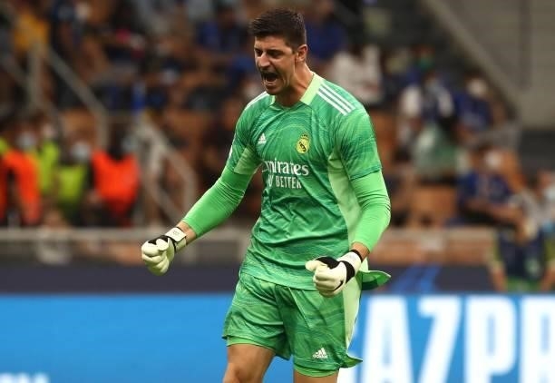 Thibaut Courtois of Real Madrid celebrates his team-mates goal during the UEFA Champions League group D match between Inter and Real Madrid at...