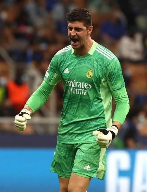 Thibaut Courtois of Real Madrid celebrates his team-mates goal during the UEFA Champions League group D match between Inter and Real Madrid at...