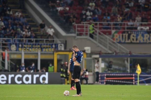 Edin Dzeko of FC Internazionale looks dejected at the end of the UEFA Champions League group D match between Inter and Real Madrid at Giuseppe Meazza...