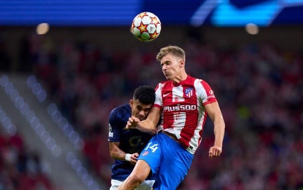 Marcos Llorente of Atletico Madrid competes for the ball with Luis Fernando Diaz Marulanda of FC Porto during the UEFA Champions League group B match...