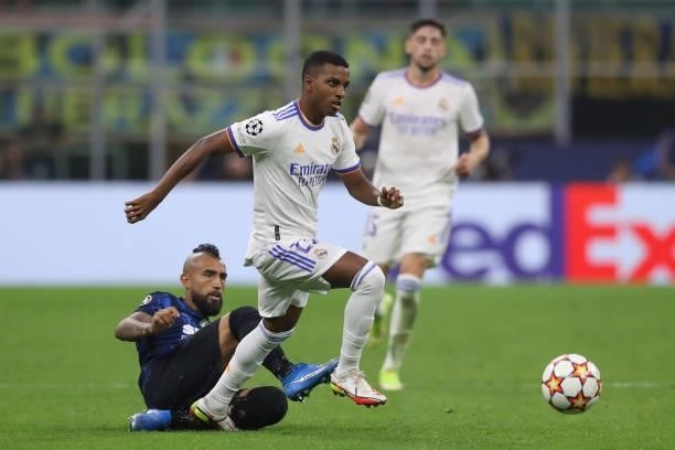 Rodrygo of Real Madrid skips over a challenge from Arturo Vidal of FC Internazionale during the UEFA Champions League group D match between Inter and...