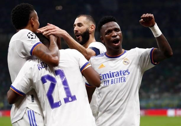 Rodrygo Goes and Éder MIlitão of Real Madrid celebrate a goal with teammates Karim Benzema and Vini Jr. During the UEFA Champions League group D...