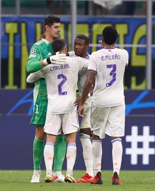 Thibaut Courtois and David Alaba of Real Madrid with teammates Daniel Carvajal and Éder Militao during the UEFA Champions League group D match...