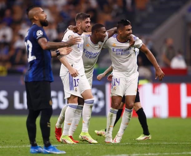 Federico Valverde and David Alaba of Real Madrid in action with teammate Carlos Casemiro during the UEFA Champions League group D match between Inter...