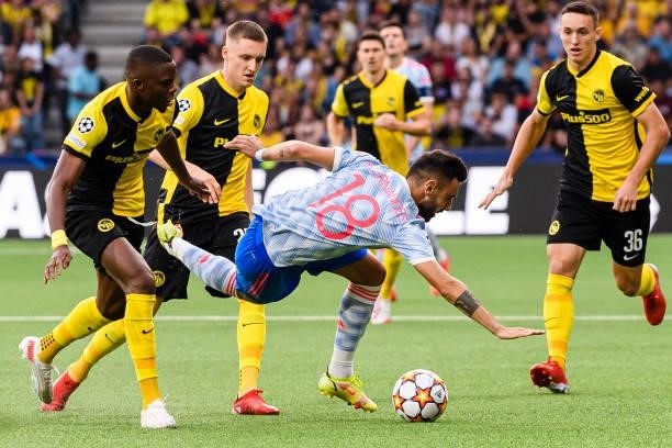 Bruno Fernandes of Manchester United is challenged by Christopher Martins of Young Boys during the UEFA Champions League group F match between BSC...