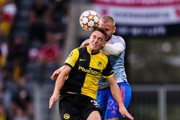 Silvan Hefti of Young Boys battles for the ball with Luke Shaw of Manchester United during the UEFA Champions League group F match between BSC Young...