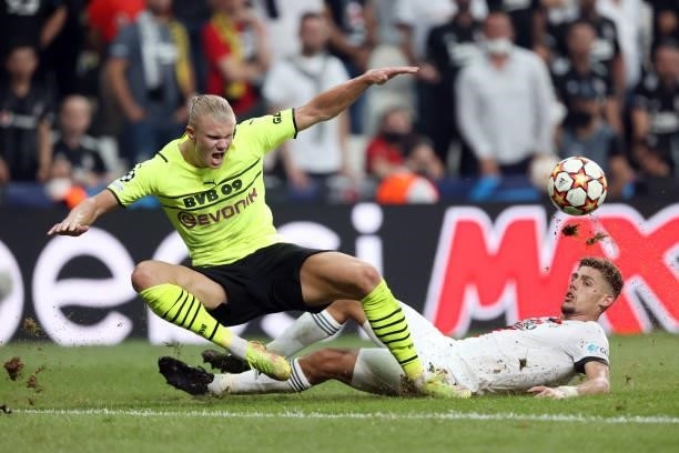 Erling Haaland of Borussia Dortmund is challenged by Francisco Montero of Besiktas during the UEFA Champions League group C match between Besiktas...