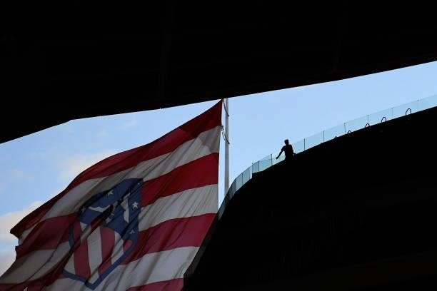 Fan walks on the stand next to an Atletico de Madrid big flag during the UEFA Champions League group B match between Atletico Madrid and FC Porto at...