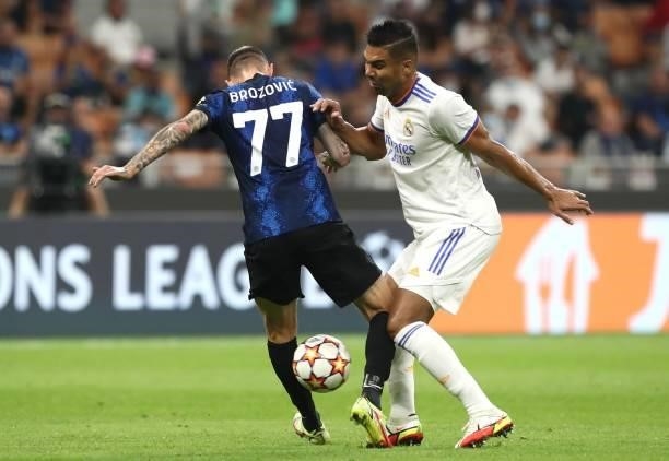 Marcelo Brozovic of FC Internazionale clashes with Casemiro of Real Madrid during the UEFA Champions League group D match between Inter and Real...