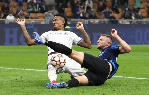 Eder Militao of Real Madrid competes for the ball with Milan Skriniar of FC Internazionale during the UEFA Champions League group D match between...