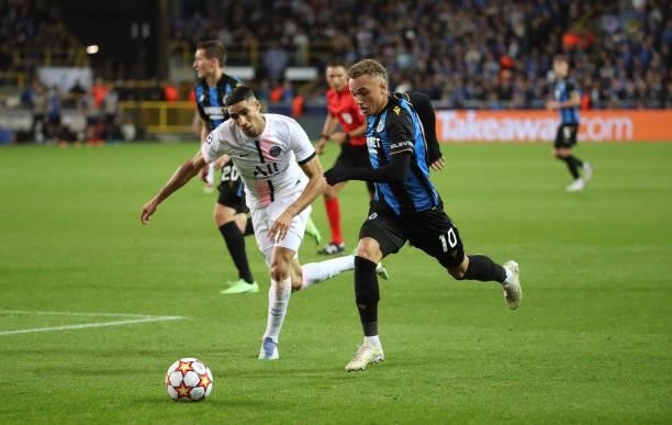 Noa Lang of Club Brugge battles for the ball with Achraf Hakimi Mouh of PSG during the UEFA Champions League group A match between Club Brugge KV and...