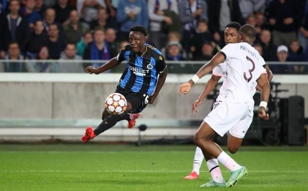Kamal Sowah of Club Brugge battles for the ball with Abdou Diallo of PSG and Presnel Kimpembe of PSG during the UEFA Champions League group A match...