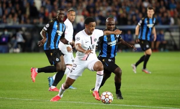 Abdou Diallo of PSG battles for the ball with Eder Balanta of Club Brugge during the UEFA Champions League group A match between Club Brugge KV and...