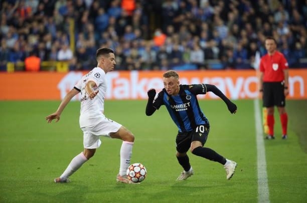Noa Lang of Club Brugge battles for the ball with Ander Herrera of PSG during the UEFA Champions League group A match between Club Brugge KV and...