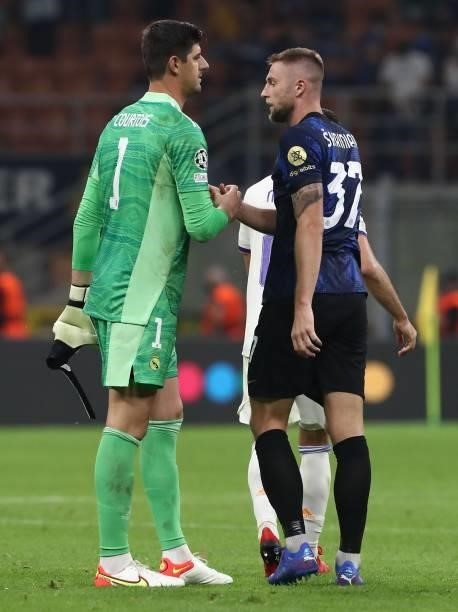Thibaut Courtois of Real Madrid shakes hands with Milan Skriniar of FC Internazionale at the end of the UEFA Champions League group D match between...