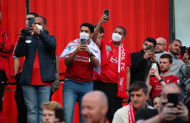 Supporters of Liverpool wait for the players coach to arrive outside Anfield prior to the UEFA Champions League group B match between Liverpool FC...