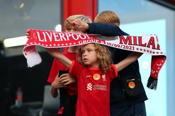 Supporters of Liverpool wait for the players coach to arrive outside Anfield prior to the UEFA Champions League group B match between Liverpool FC...