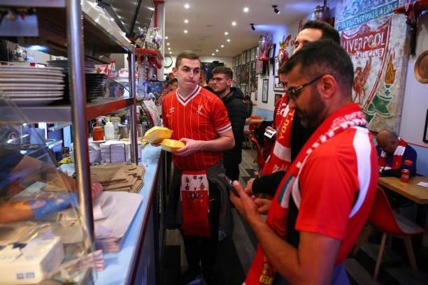 Supporters of Liverpool eat at the Georgie Porgy Cafe prior to the UEFA Champions League group B match between Liverpool FC and AC Milan at Anfield...