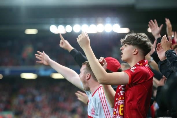 Liverpool fan shows his support during the UEFA Champions League group B match between Liverpool FC and AC Milan at Anfield on September 15, 2021 in...