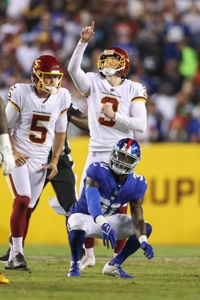 Dustin Hopkins of the Washington Football Team reacts to kicking a field goal during the third quarter against the New York Giants at FedExField on...