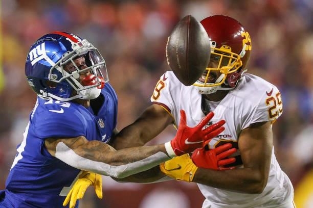Kendall Fuller of the Washington Football Team and Kenny Golladay of the New York Giants unable to gain control of the ball during the third quarter...