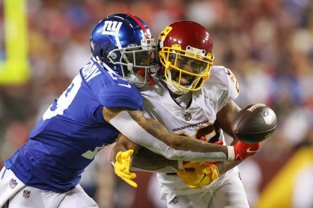 Kendall Fuller of the Washington Football Team and Kenny Golladay of the New York Giants unable to gain control of the ball during the third quarter...