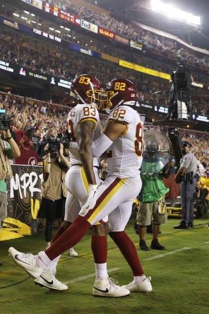 Ricky Seals-Jones of the Washington Football Team and Logan Thomas celebrate a touchdown together during the fourth quarter against the New York...