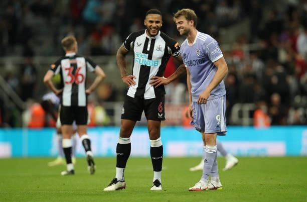 Jamaal Lascelles of Newcastle United and Patrick Bamford of Leeds United interact after the Premier League match between Newcastle United and Leeds...