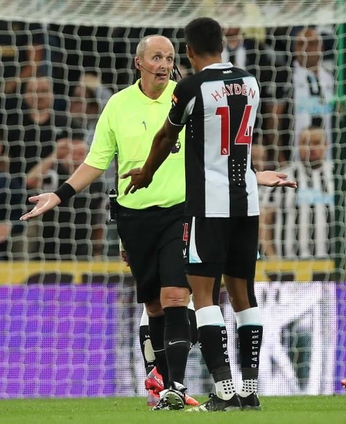 Referee Mike Dean interacts with Isaac Hayden of Newcastle United during the Premier League match between Newcastle United and Leeds United at St....
