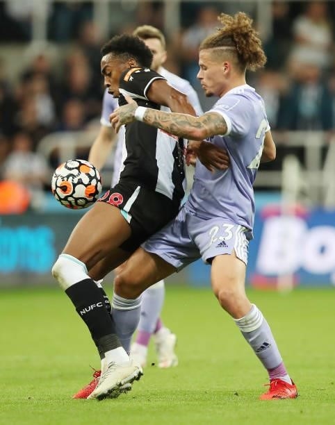 Joe Willock of Newcastle United vies with Kalvin Phillips of Leeds United during the Premier League match between Newcastle United and Leeds United...